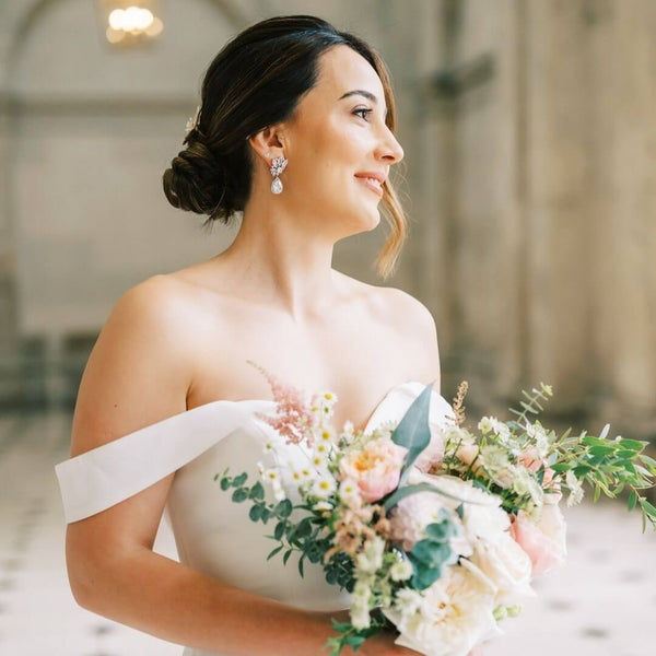 Ingrid wore the Harlow clustered crystal bridal statement earrings by Aria. Photography by Anne Siqueira.