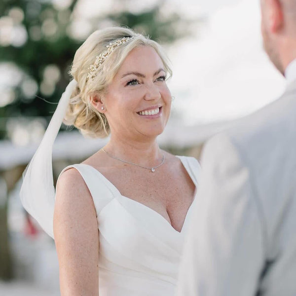 Rebecca wore the Gaia crystal embellished leaves & pearl buds gold hair vine by Aria. Photography by Coresfilms.