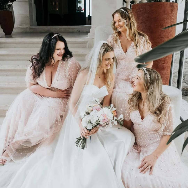 Abigail's bridesmaids wore the Blysse blush blossoms hair vines (silver) and Grace crystal &amp; pearl earrings (silver) by Aria. Photography by Jenny Appleton.