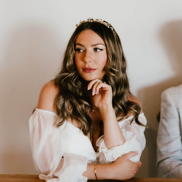Hannah wore the Midsummer gold leaf pearl crown by Laurel Lime. Photography by Pippa Volans Photography.